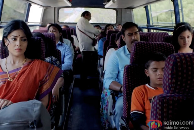 Shriya Saran, Ajay Devgn and Ishita Dutta in a still from movie ‘Drishyam’